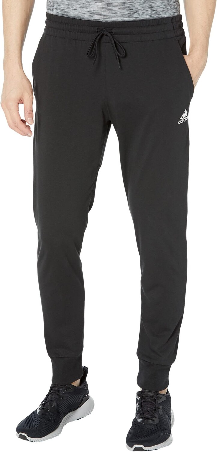 Брюки зауженного кроя с манжетами из одинарного джерси Essentials adidas, черный 
Брюки зауженного кроя с манжетами из одинарного джерси Essentials adidas, черный