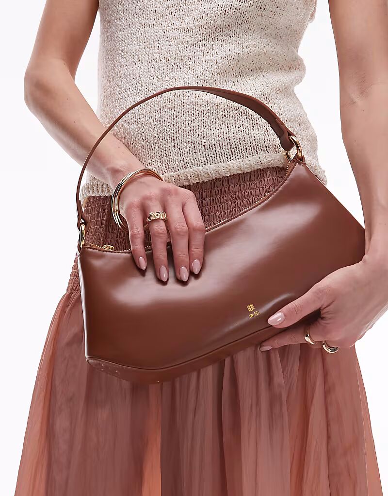 Сумка через плечо JW PEI изогнутой формы коричневого цвета
Сумка через плечо JW PEI изогнутой формы коричневого цвета