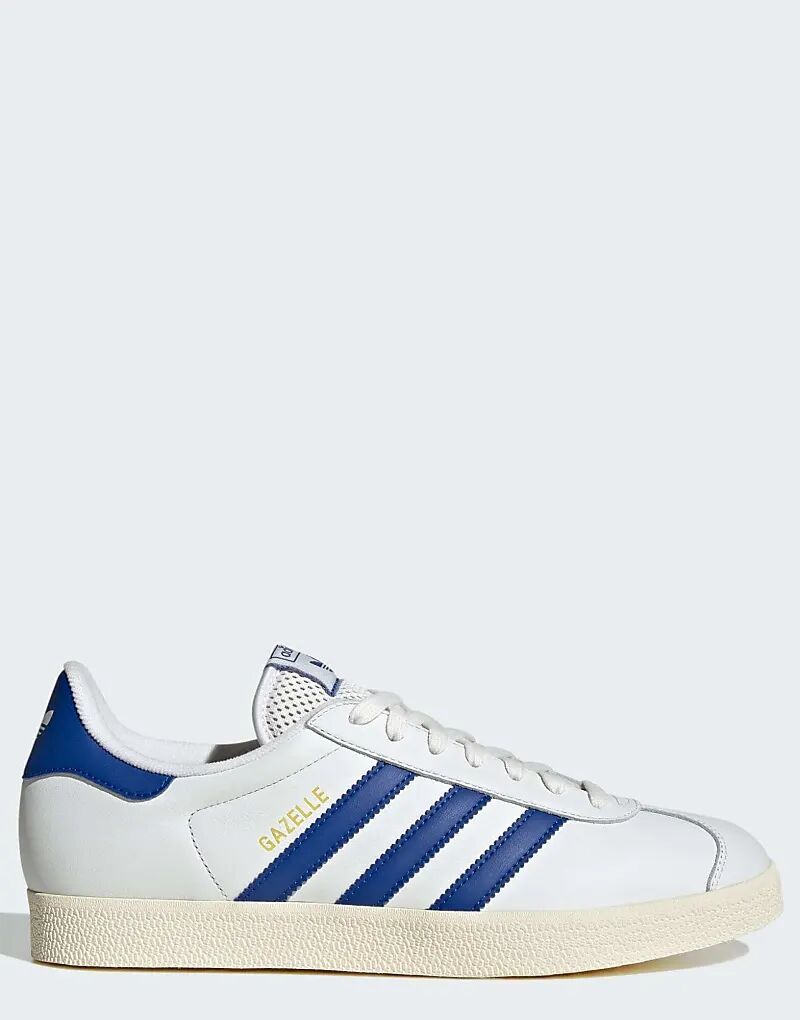 Кроссовки adidas Originals Gazelle в цвете: белый, королевский синий, кремовый.
Кроссовки adidas Originals Gazelle в цвете: белый, королевский синий, кремовый.