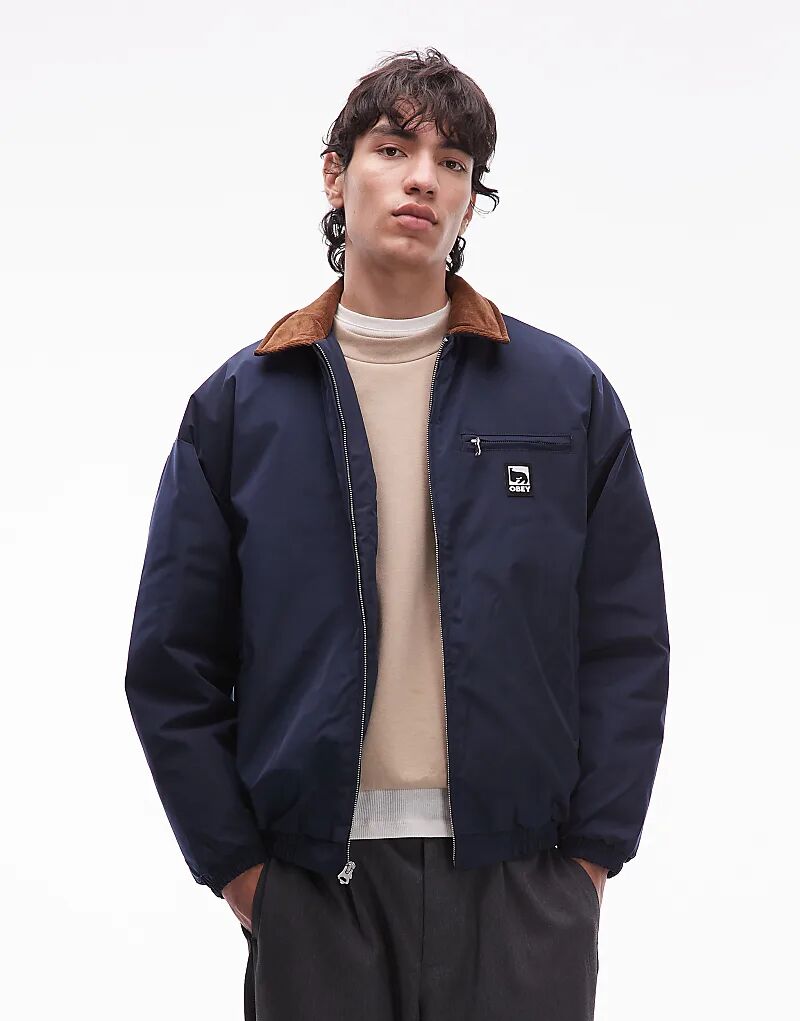 Куртка Obey Elysian Worker темно-синего цвета с контрастным воротником
Куртка Obey Elysian Worker темно-синего цвета с контрастным воротником