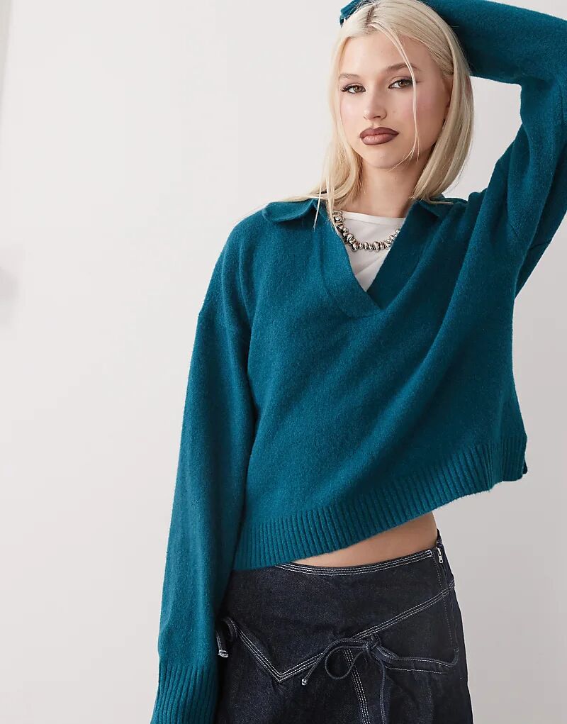 Свитер-поло с длинными рукавами и воротником в бирюзовом цвете Monki
Свитер-поло с длинными рукавами и воротником в бирюзовом цвете Monki