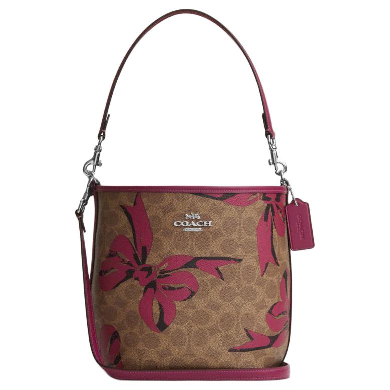 COACH Городская сумка-ведро из прорезиненного хлопка с наплечным ремнем в розовом цвете с бабочками
COACH Городская сумка-ведро из прорезиненного хлопка с наплечным ремнем в розовом цвете с бабочками
