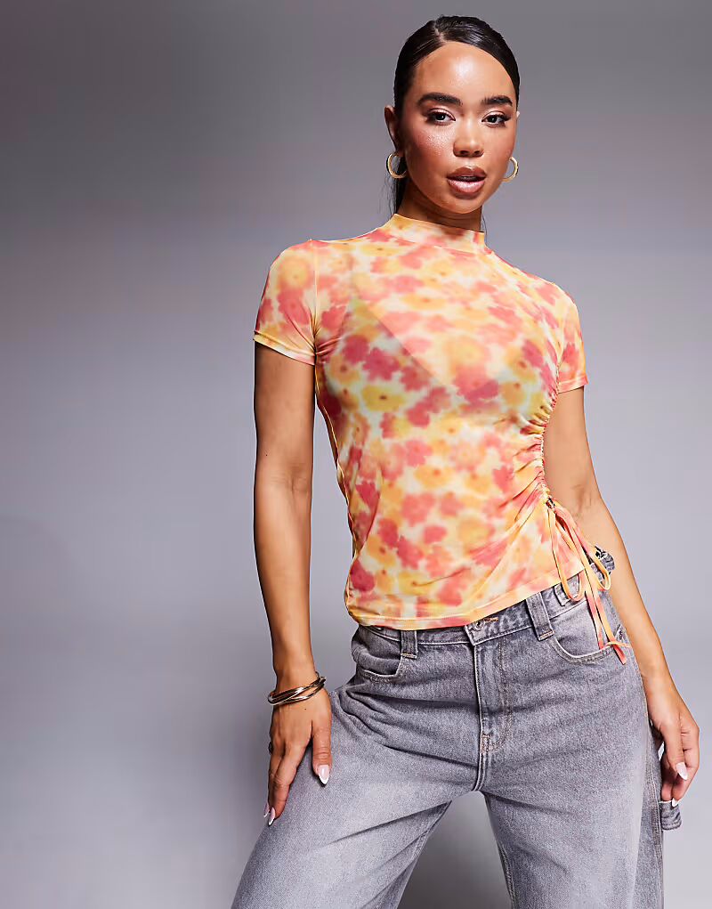 Футболка Hugo Red из сетки с высоким воротом, цветочным принтом желтого и розового цветов, с завязками сбоку и сборками
Футболка Hugo Red из сетки с высоким воротом, цветочным принтом желтого и розового цветов, с завязками сбоку и сборками