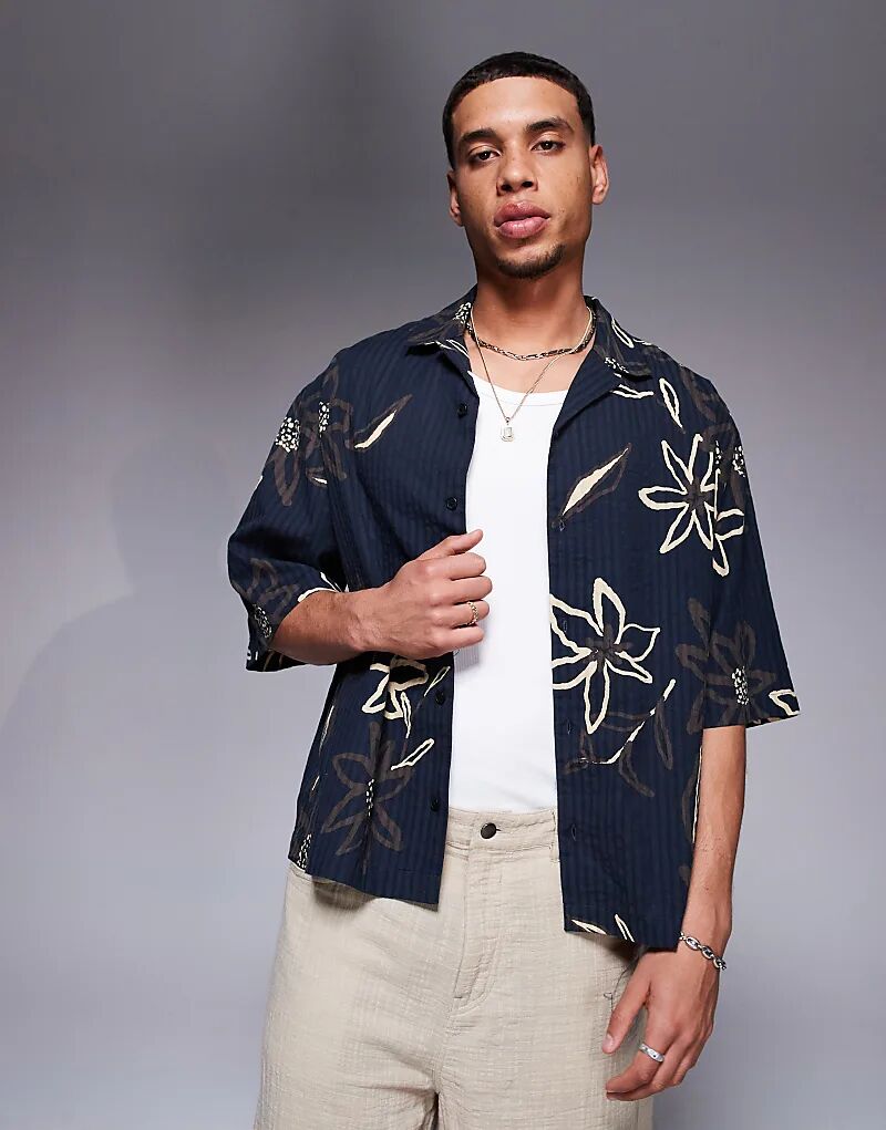 Рубашка свободного кроя из сирсакера ASOS DESIGN черного цвета с цветочным принтом
Рубашка свободного кроя из сирсакера ASOS DESIGN черного цвета с цветочным принтом