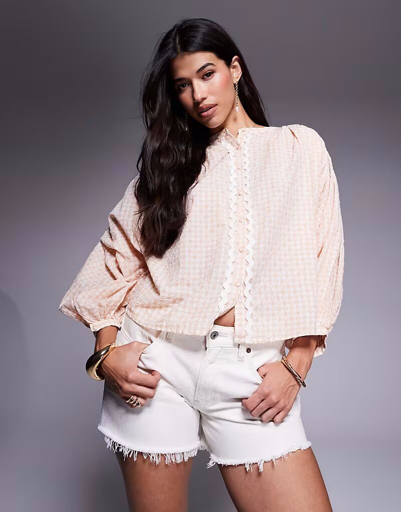 Блузка в клетку River Island оранжевого цвета
Блузка в клетку River Island оранжевого цвета