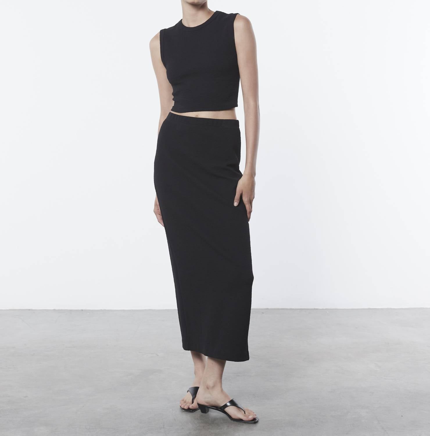 Черный укороченный топ с жаккардовым узором Enza Costa
Черный укороченный топ с жаккардовым узором Enza Costa