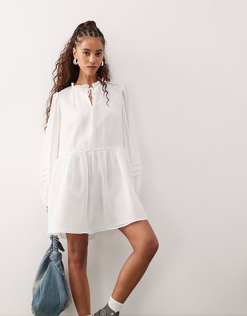 Восстановленное винтажное мини-платье в стиле вестерн с завязывающимся спереди воротником цвета слоновой кости Reclaimed Vintage
Восстановленное винтажное мини-платье в стиле вестерн с завязывающимся спереди воротником цвета слоновой кости Reclaimed Vintage