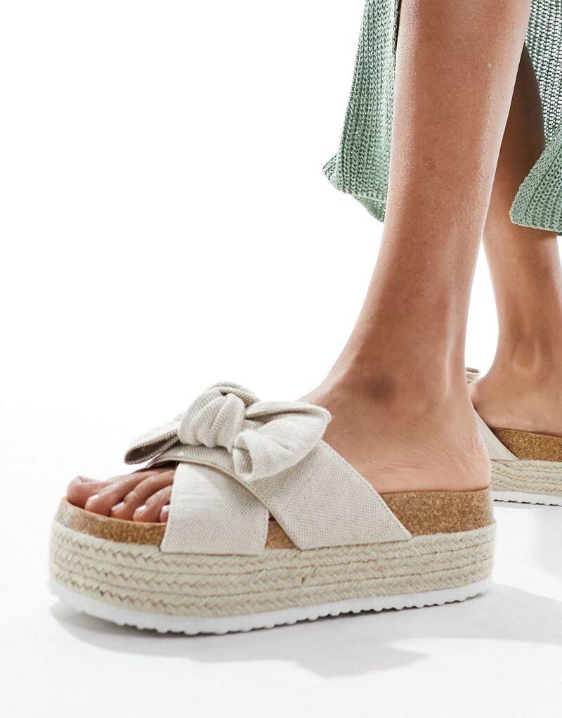 ASOS DESIGN – Спасибо – Босоножки на плоской платформе с декоративным бантом натурального цвета
ASOS DESIGN – Спасибо – Босоножки на плоской платформе с декоративным бантом натурального цвета