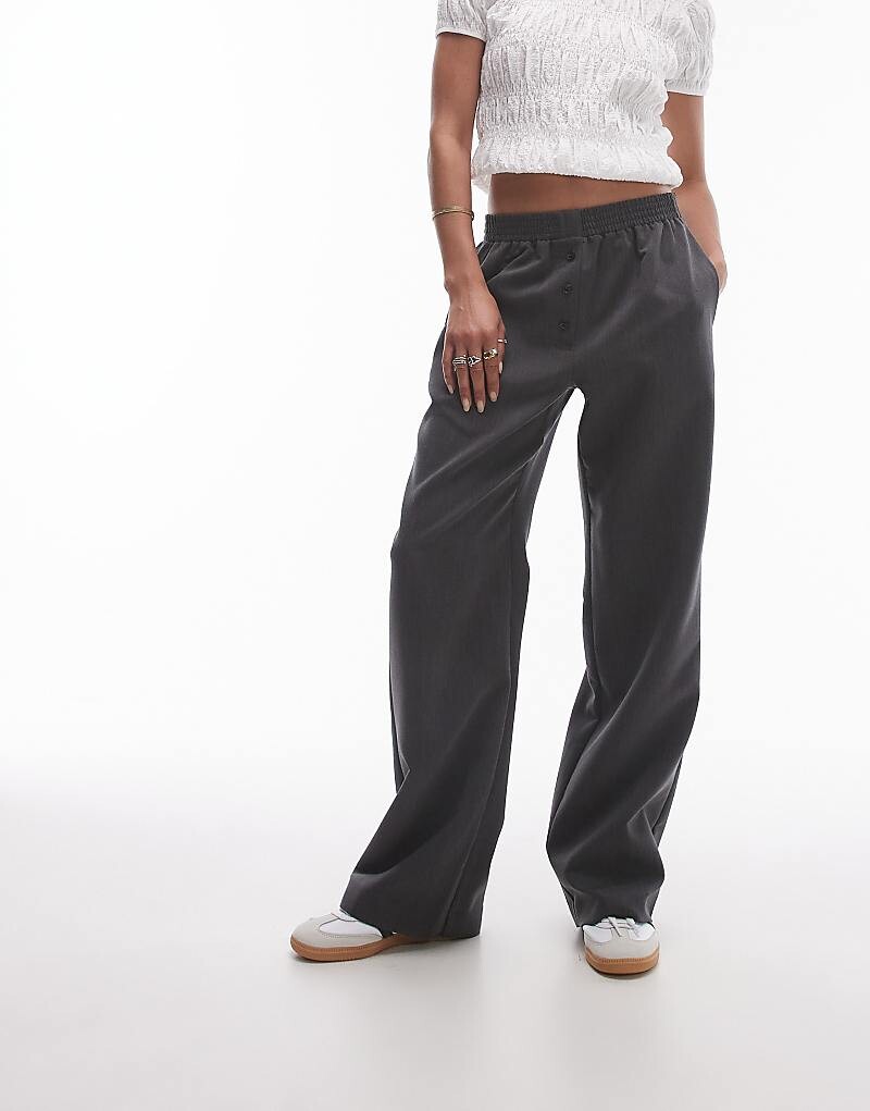 Темно-серые джоггеры на пуговицах Topshop
Темно-серые джоггеры на пуговицах Topshop