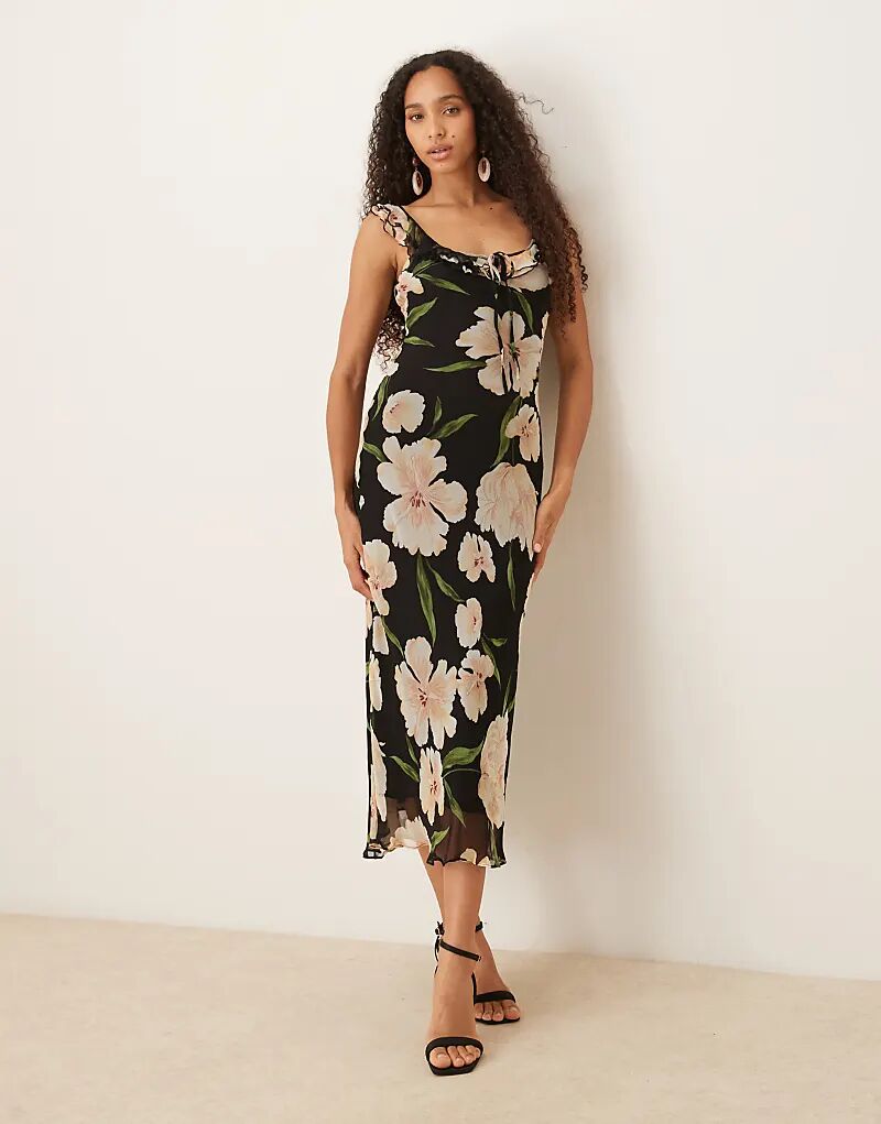 Платье макси без рукавов с отделкой воланами цвета Mango и темным цветочным принтом
Платье макси без рукавов с отделкой воланами цвета Mango и темным цветочным принтом