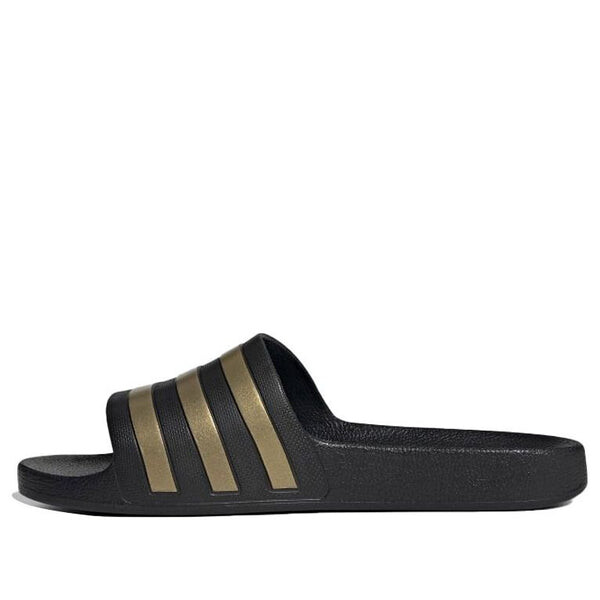Тапочки adilette aqua slides 'black gold metallic' Adidas, черный
Тапочки adilette aqua slides 'black gold metallic' Adidas, черный