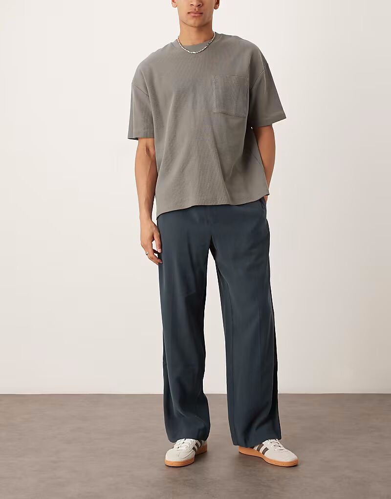 Широкие брюки ASOS DESIGN темно-синего цвета с эластичной талией и полосками по бокам
Широкие брюки ASOS DESIGN темно-синего цвета с эластичной талией и полосками по бокам