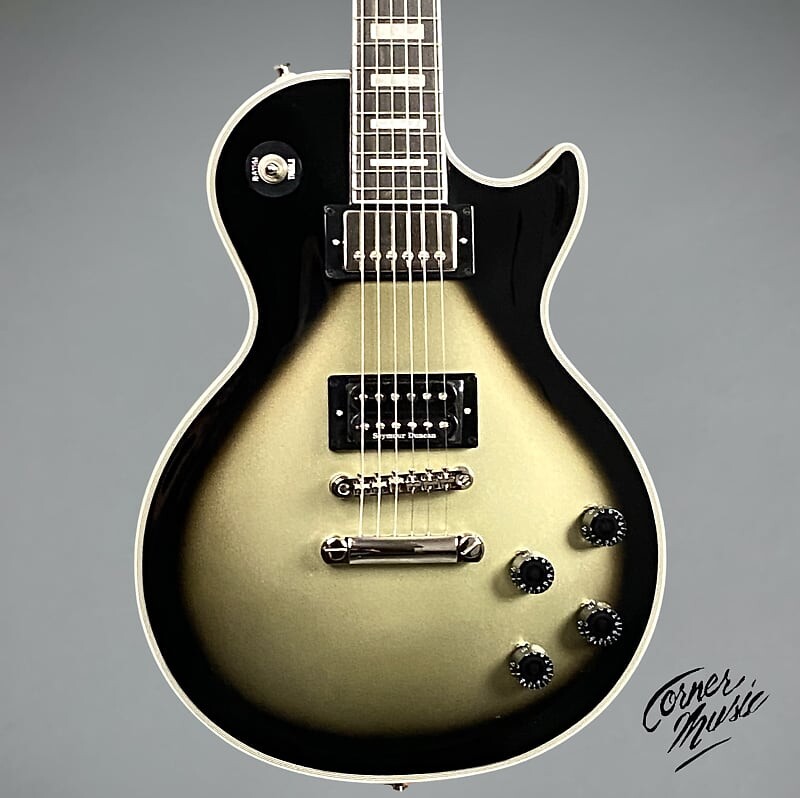 Электрогитара Epiphone Adam Jones Les Paul Custom Art Collection: Korin Faught’s “Sensation” 2023 - Antique Silverburst
Электрогитара Epiphone Adam Jones Les Paul Custom Art Collection: Korin Faught’s “Sensation” 2023 - Antique Silverburst