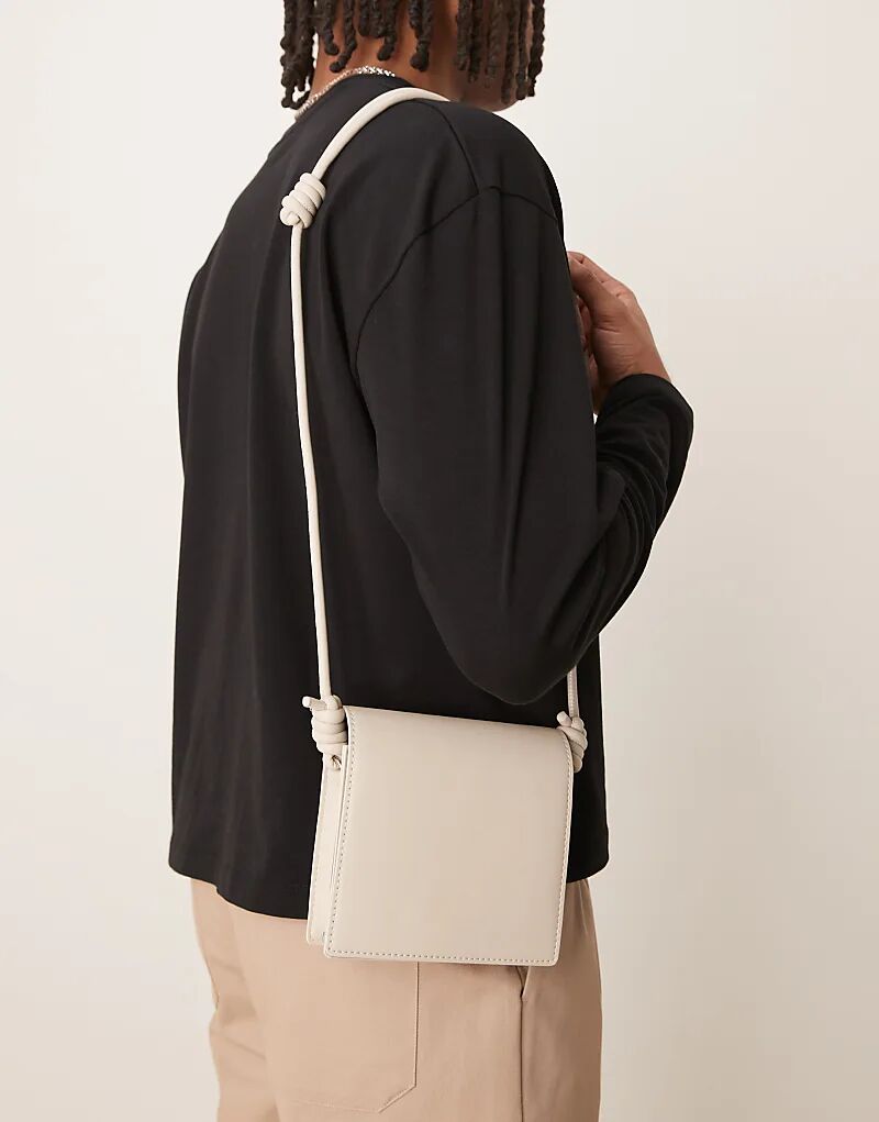 Сумка через плечо ASOS DESIGN из искусственной кожи с ремешком в цвете экрю
Сумка через плечо ASOS DESIGN из искусственной кожи с ремешком в цвете экрю