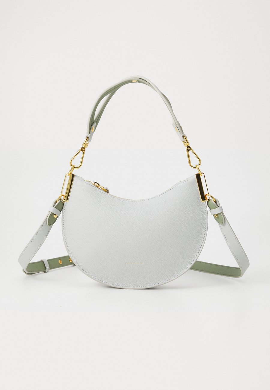 Сумка Coccinelle Handbag, Snow/Greenery/Off-White
Сумка Coccinelle Handbag, Snow/Greenery/Off-White