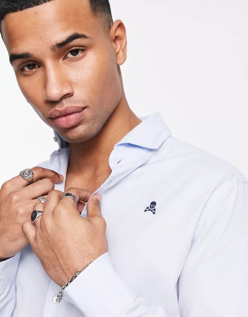 Небесно-голубая рубашка Scalpers Elisee
Небесно-голубая рубашка Scalpers Elisee