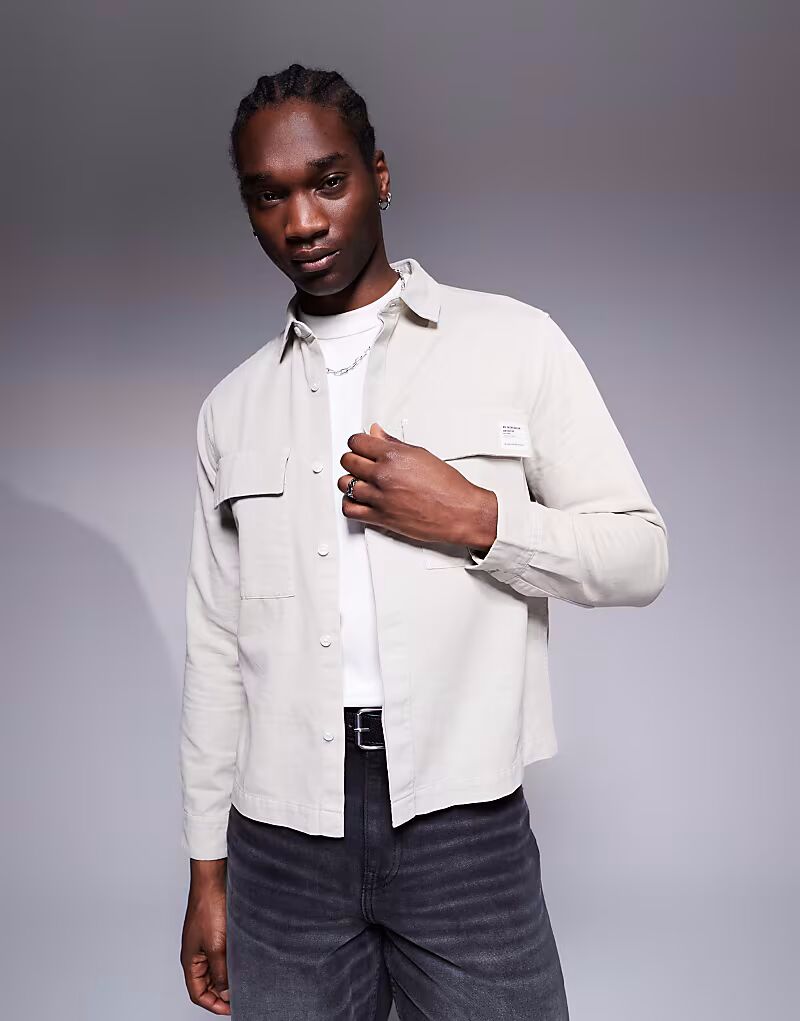 Рубашка свободного кроя ASOS DESIGN каменно-серого цвета с нашивкой
Рубашка свободного кроя ASOS DESIGN каменно-серого цвета с нашивкой