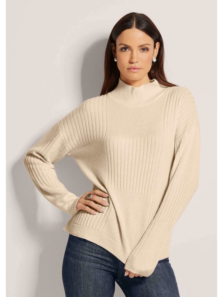 MADELEINE Свитер со стоячим воротником из натуральной шерсти кремового цвета
MADELEINE Свитер со стоячим воротником из натуральной шерсти кремового цвета