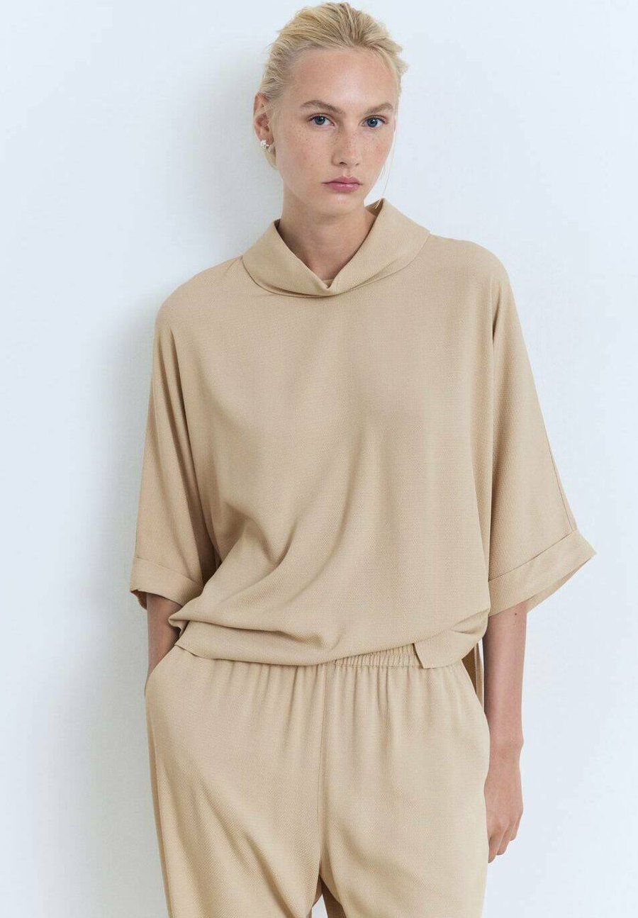 Блуза Mango FLOWING, Beige
Блуза Mango FLOWING, Beige