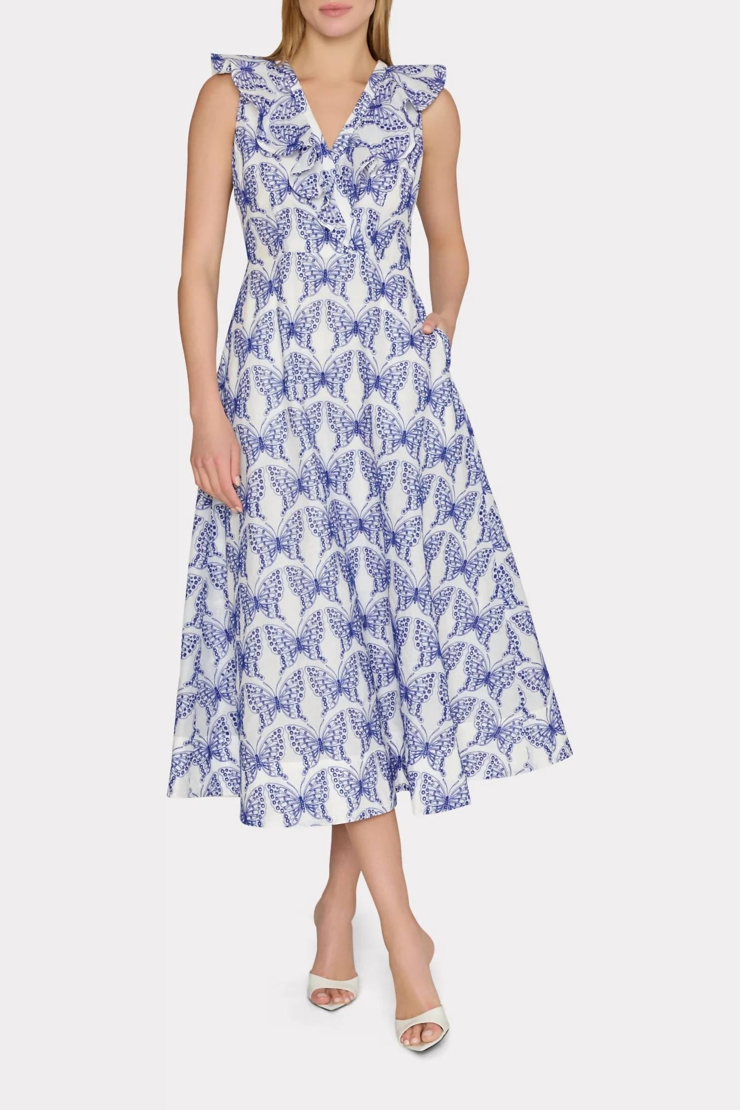 Бело-голубое миди-платье с рюшами и люверсами-бабочками MILLY
Бело-голубое миди-платье с рюшами и люверсами-бабочками MILLY