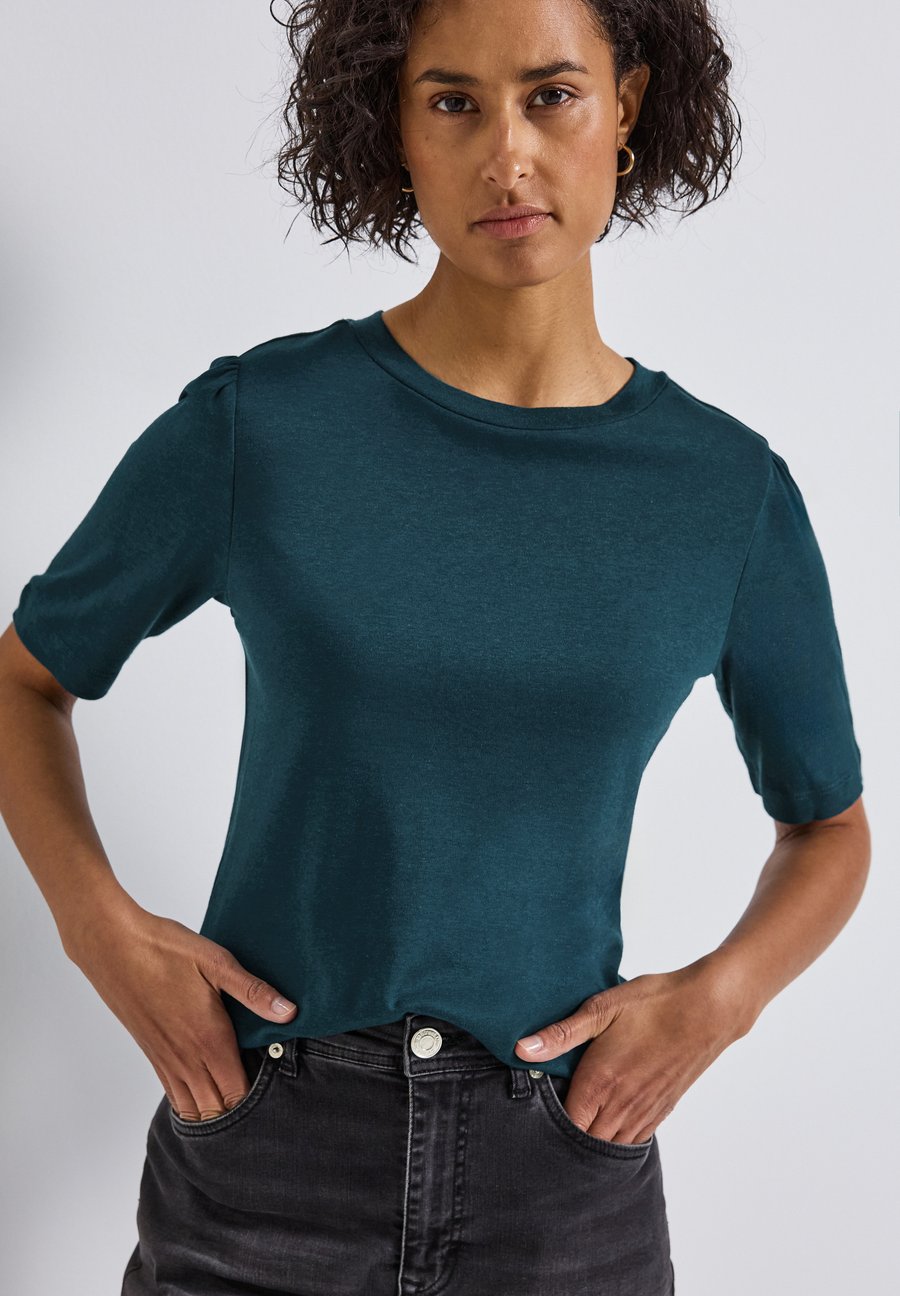 Футболка Street One MIT RAFFUNG, Türkis/Teal
Футболка Street One MIT RAFFUNG, Türkis/Teal