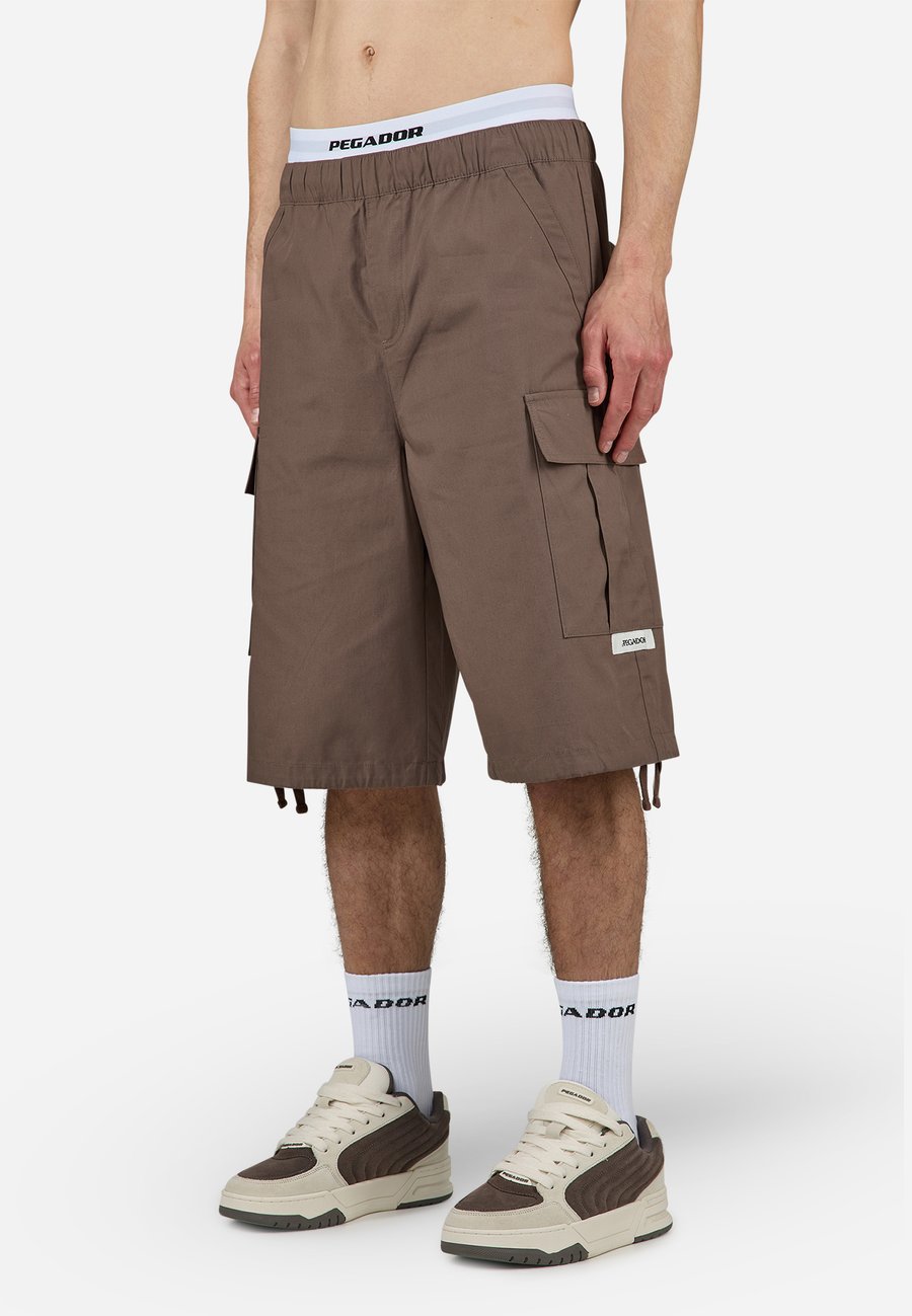 Шорты Pegador MEEKER PARACHUTE, Cozy Brown/Brown
Шорты Pegador MEEKER PARACHUTE, Cozy Brown/Brown