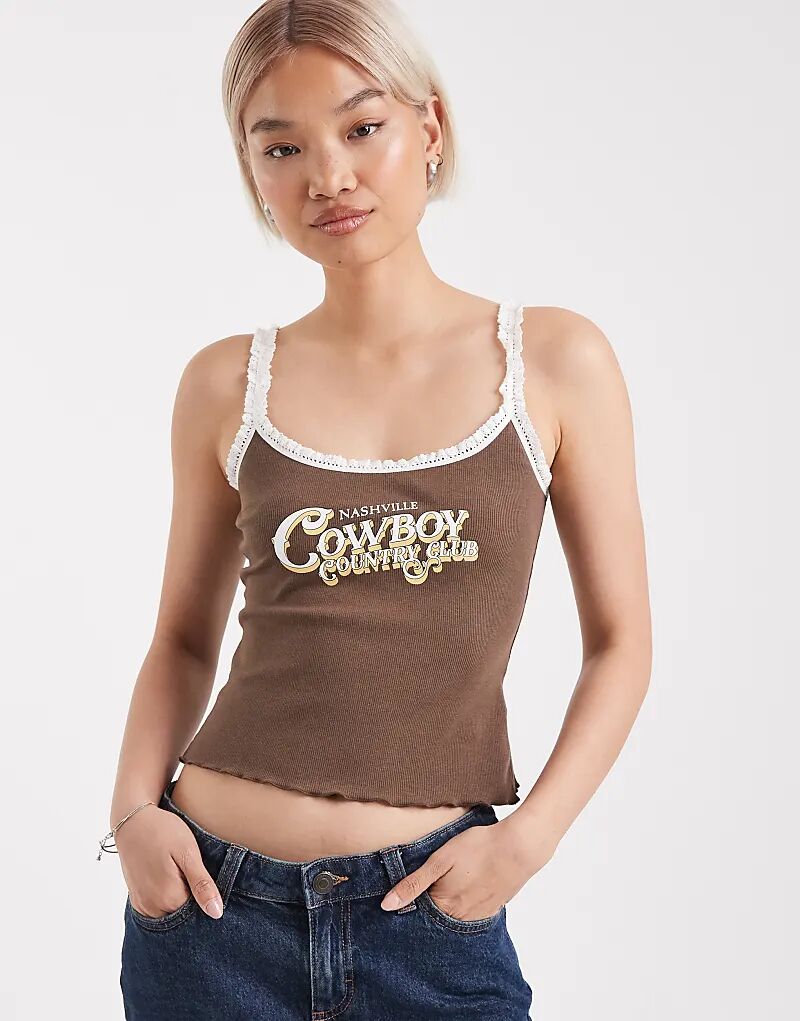 Майка с ковбойским принтом в стиле «Нэшвилл» Edikted коричневого цвета
Майка с ковбойским принтом в стиле «Нэшвилл» Edikted коричневого цвета