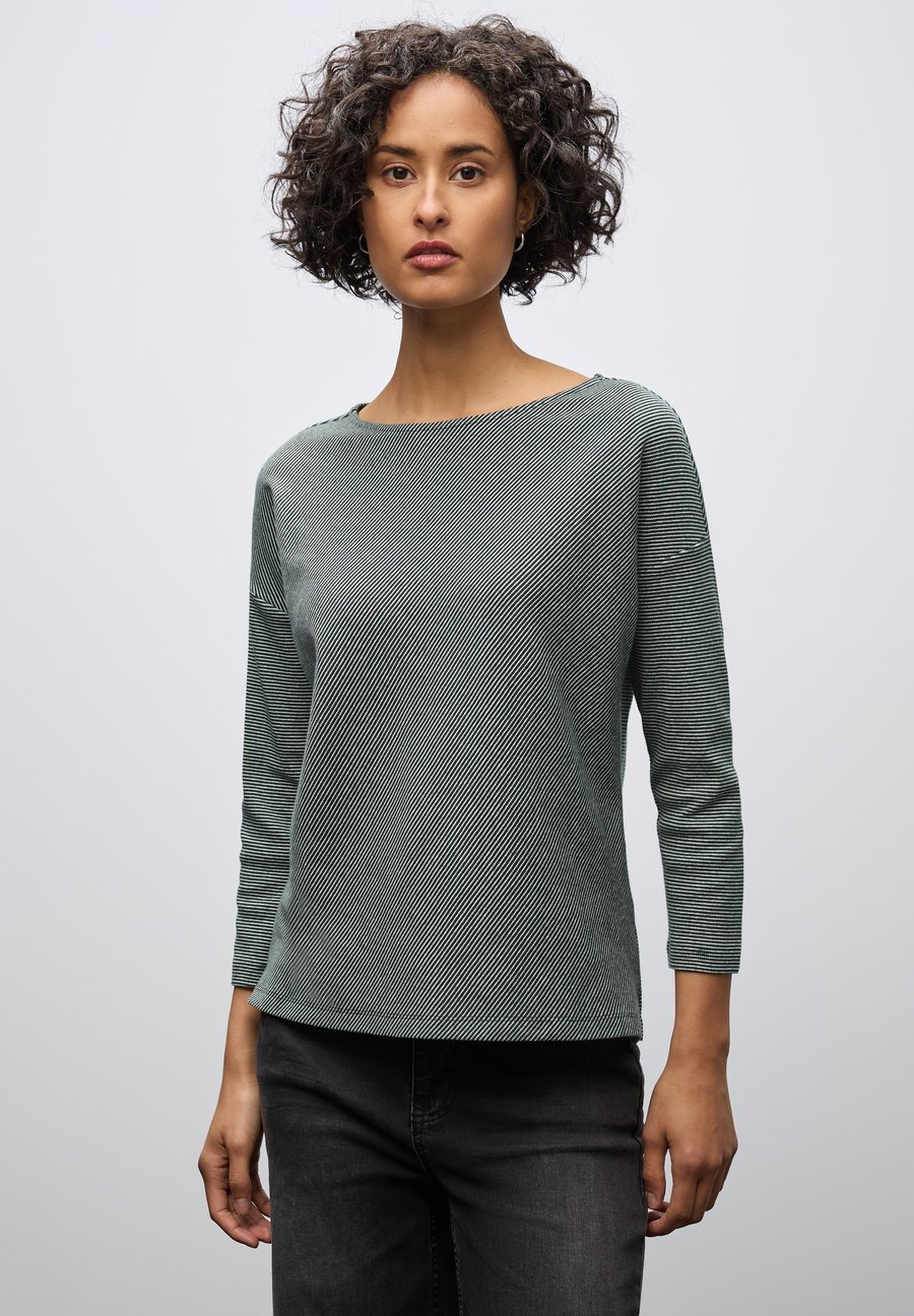 Топ Street One SHIRT MIT STRUKTUR, Grün/Dark Green
Топ Street One SHIRT MIT STRUKTUR, Grün/Dark Green