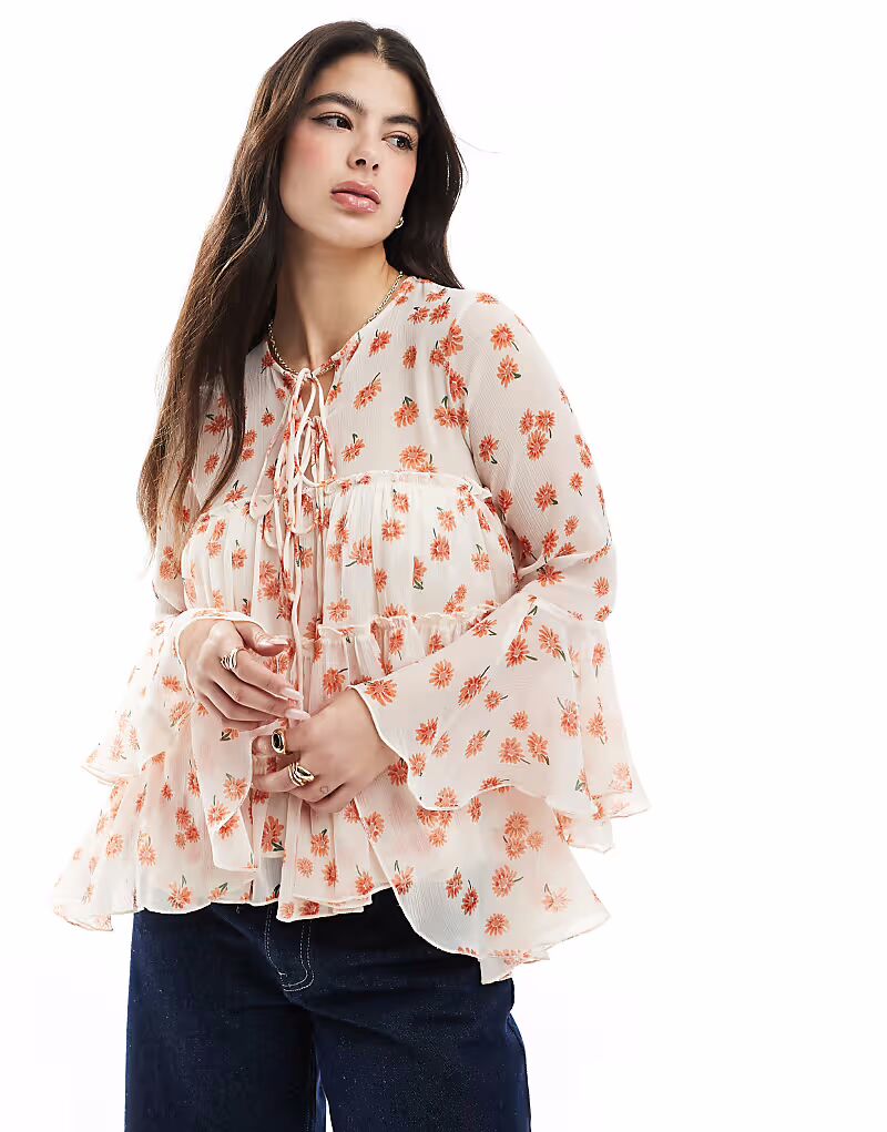 Блузка ASOS DESIGN с завязкой спереди, оборками на манжетах и цветочным принтом
Блузка ASOS DESIGN с завязкой спереди, оборками на манжетах и цветочным принтом