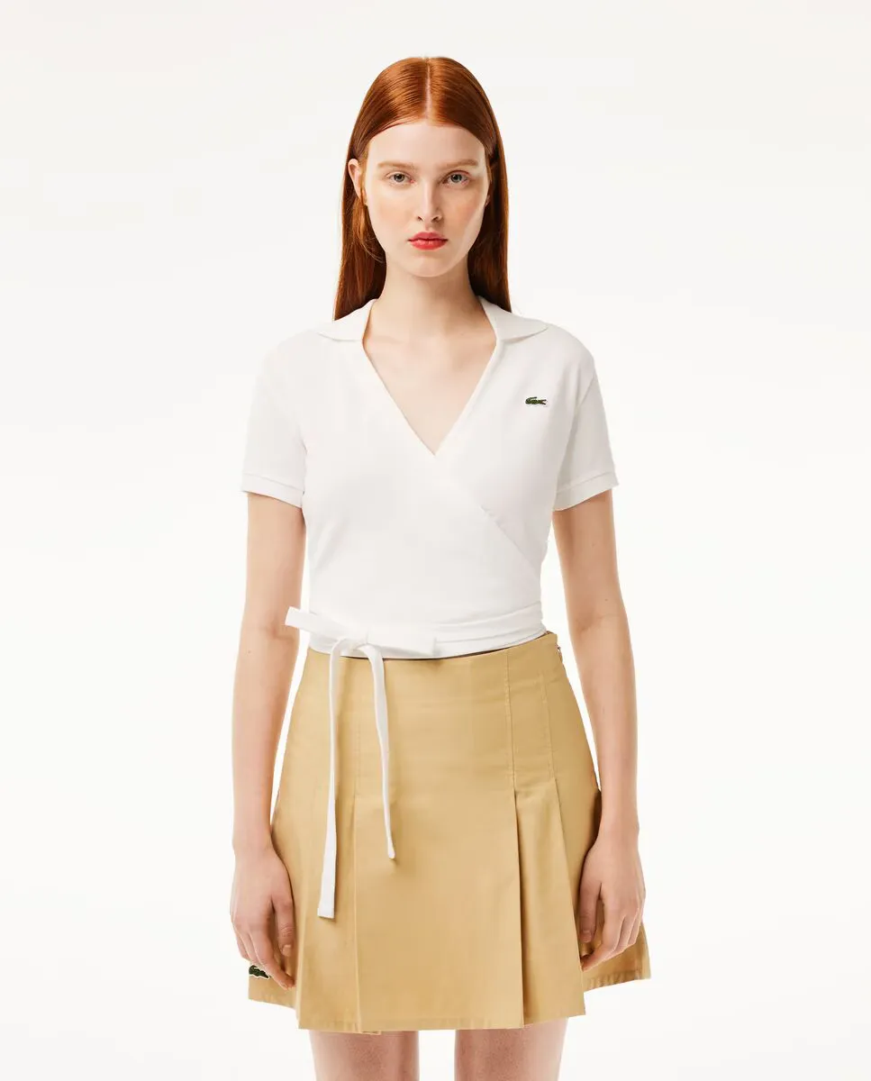 Женская поло из эластичного пике с перекрестным деталями на коротком рукаве Lacoste, белый
Женская поло из эластичного пике с перекрестным деталями на коротком рукаве Lacoste, белый