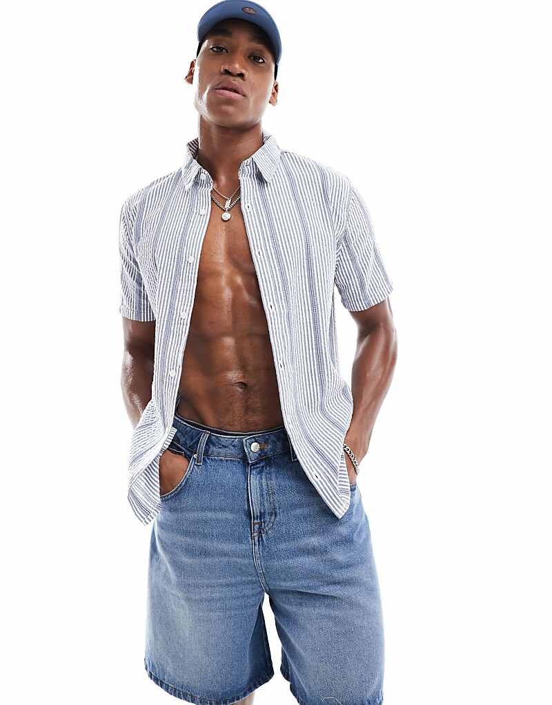 Hollister – Рубашка из жатого хлопка в полоску с короткими рукавами (Темно-синий/белый) =
Hollister – Рубашка из жатого хлопка в полоску с короткими рукавами (Темно-синий/белый) =