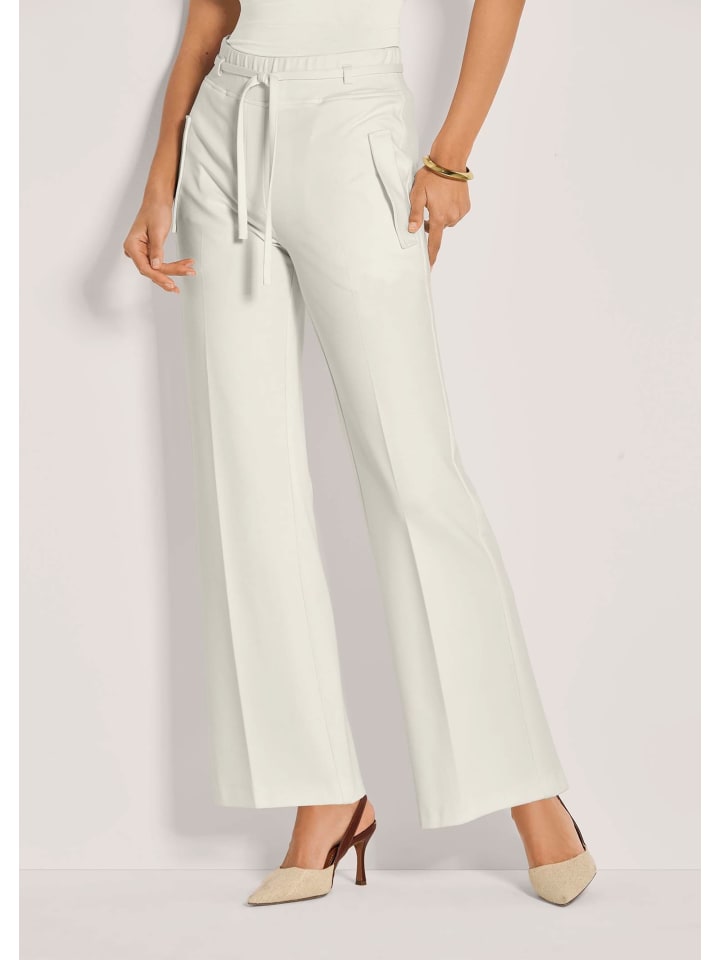 MADELEINE Широкие трикотажные брюки со складками, кремового цвета
MADELEINE Широкие трикотажные брюки со складками, кремового цвета