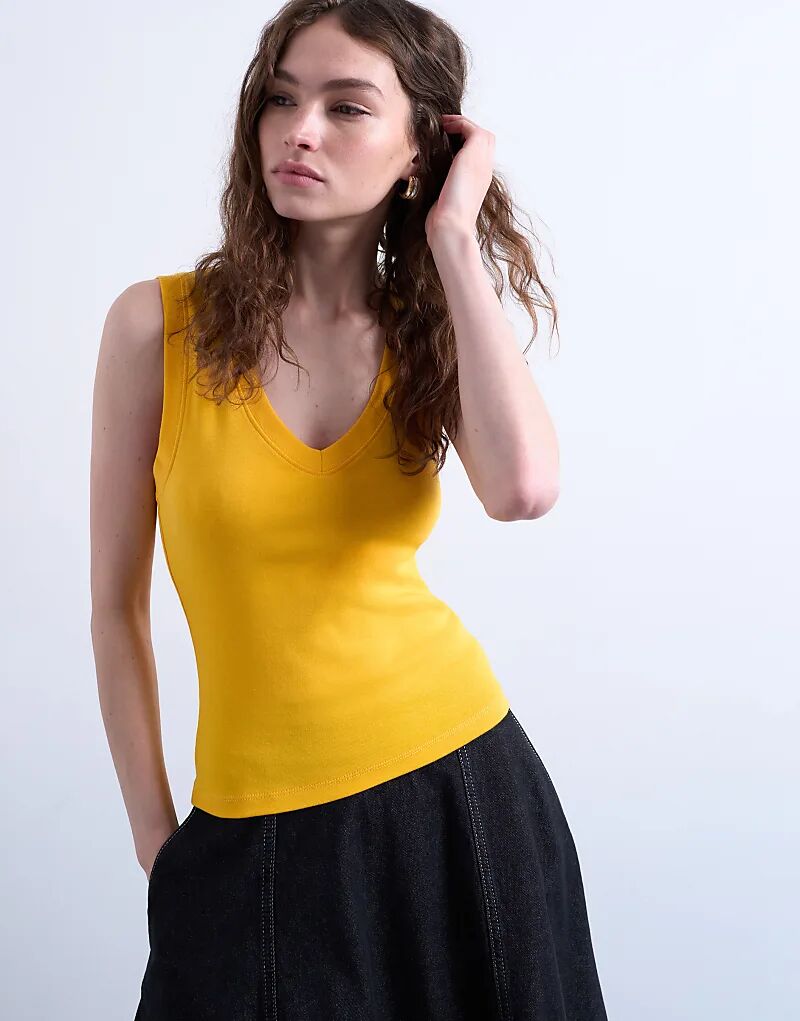 Майка без рукавов с глубоким V-образным вырезом от Topshop оранжевого цвета
Майка без рукавов с глубоким V-образным вырезом от Topshop оранжевого цвета