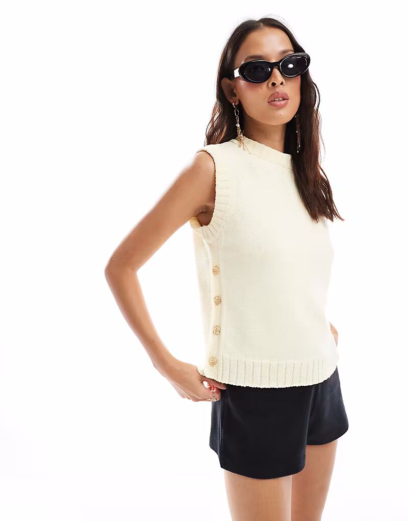 Трикотажная майка ASOS DESIGN с застежкой на пуговицы по бокам цвета пахты
Трикотажная майка ASOS DESIGN с застежкой на пуговицы по бокам цвета пахты