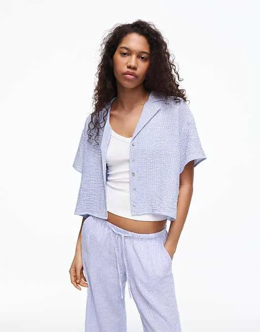 Синяя джинсовая рубашка с короткими рукавами Bershka Rustic
Синяя джинсовая рубашка с короткими рукавами Bershka Rustic