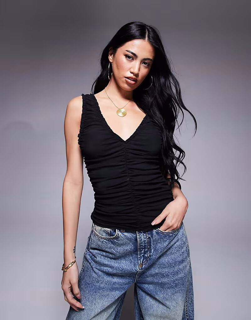 Топ из сетчатой ткани без рукавов с отделкой сборками черного цвета от ASOS DESIGN
Топ из сетчатой ткани без рукавов с отделкой сборками черного цвета от ASOS DESIGN