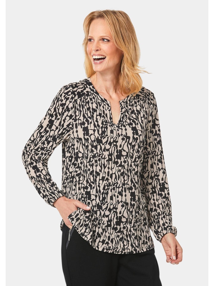 Блузка из джерси. Элегантная блузка-рубашка с V-образным вырезом песочного/черного цвета с узором. GOLDNER
Блузка из джерси. Элегантная блузка-рубашка с V-образным вырезом песочного/черного цвета с узором. GOLDNER