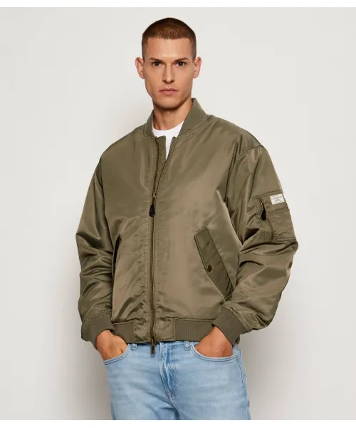 Полет Бомбера Regular fit Guess Jeans, зеленый
Полет Бомбера Regular fit Guess Jeans, зеленый