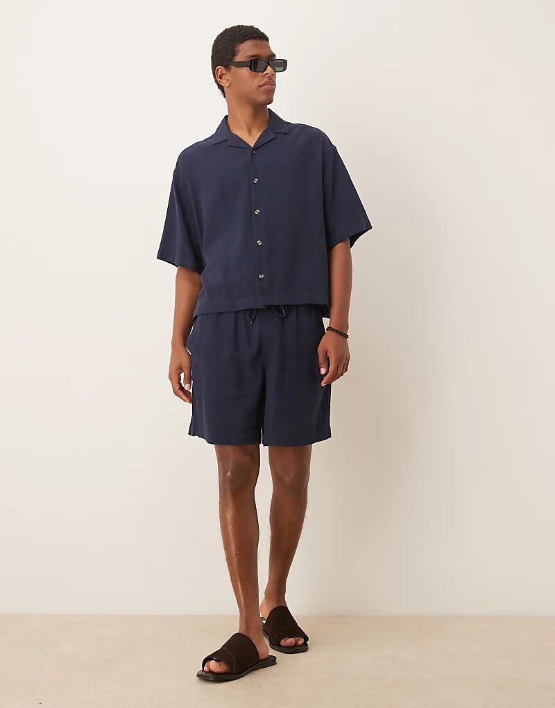 Шорты свободного кроя ASOS DESIGN из темно-синего льна с богатым кроем
Шорты свободного кроя ASOS DESIGN из темно-синего льна с богатым кроем