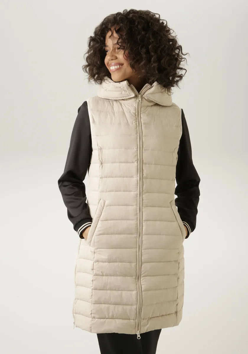 Стеганый жилет Aniston CASUAL с регулируемым капюшоном, бежевый
Стеганый жилет Aniston CASUAL с регулируемым капюшоном, бежевый