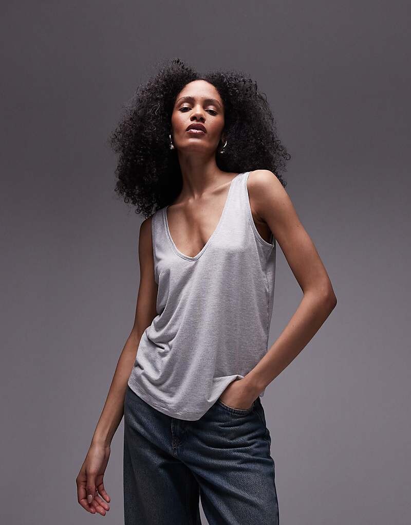 Topshop – Premium – Высококачественная свободная майка пестрого серого цвета с V-образным вырезом
Topshop – Premium – Высококачественная свободная майка пестрого серого цвета с V-образным вырезом