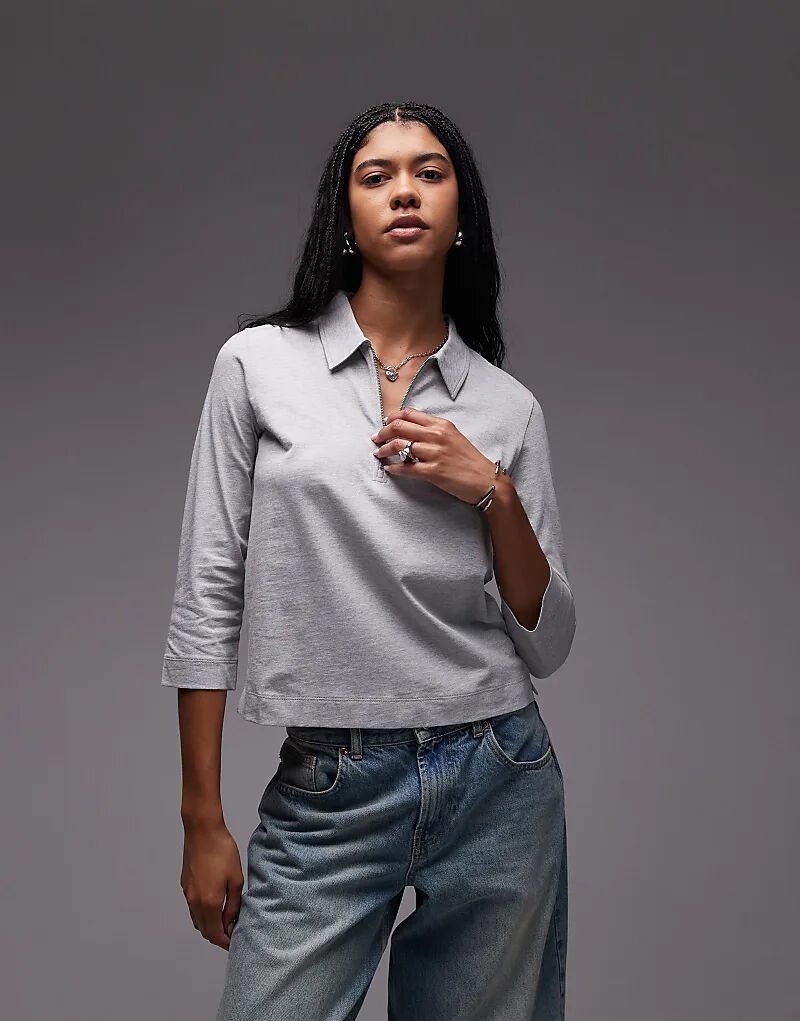 Трикотажный топ-поло ARKET с отделкой в рубчик, воротником-молнией и рукавами длиной 3/4 серого цвета
Трикотажный топ-поло ARKET с отделкой в рубчик, воротником-молнией и рукавами длиной 3/4 серого цвета