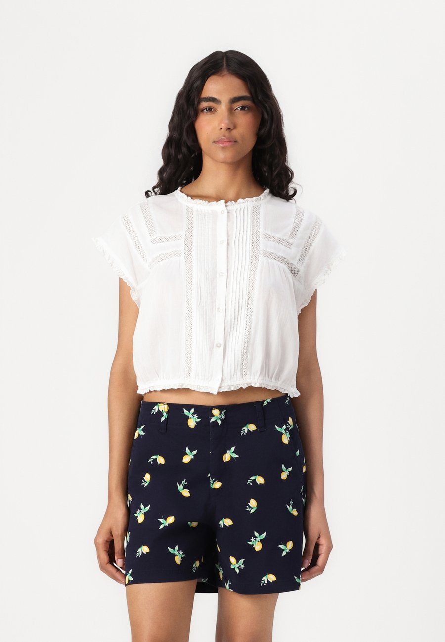 Блуза GAP RUFFLE TRIM FASHION SHIRT, New Off White/Off-White
Блуза GAP RUFFLE TRIM FASHION SHIRT, New Off White/Off-White