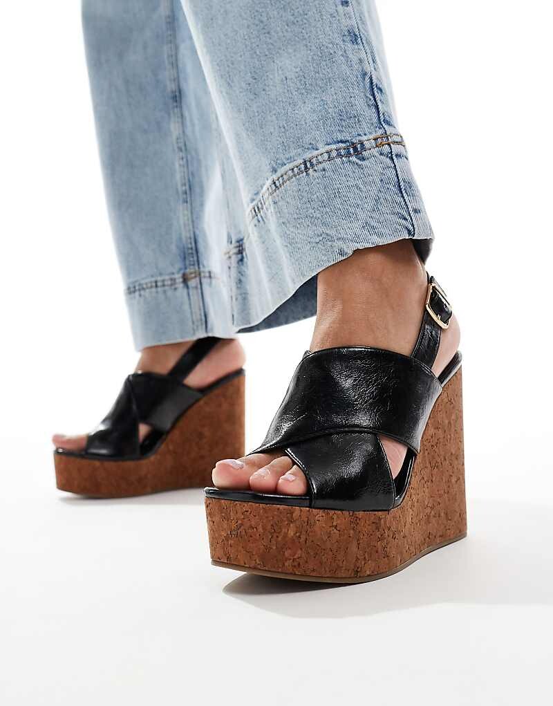 ASOS DESIGN – Tamara – Черные туфли на танкетке с перекрещенными бретелями
ASOS DESIGN – Tamara – Черные туфли на танкетке с перекрещенными бретелями