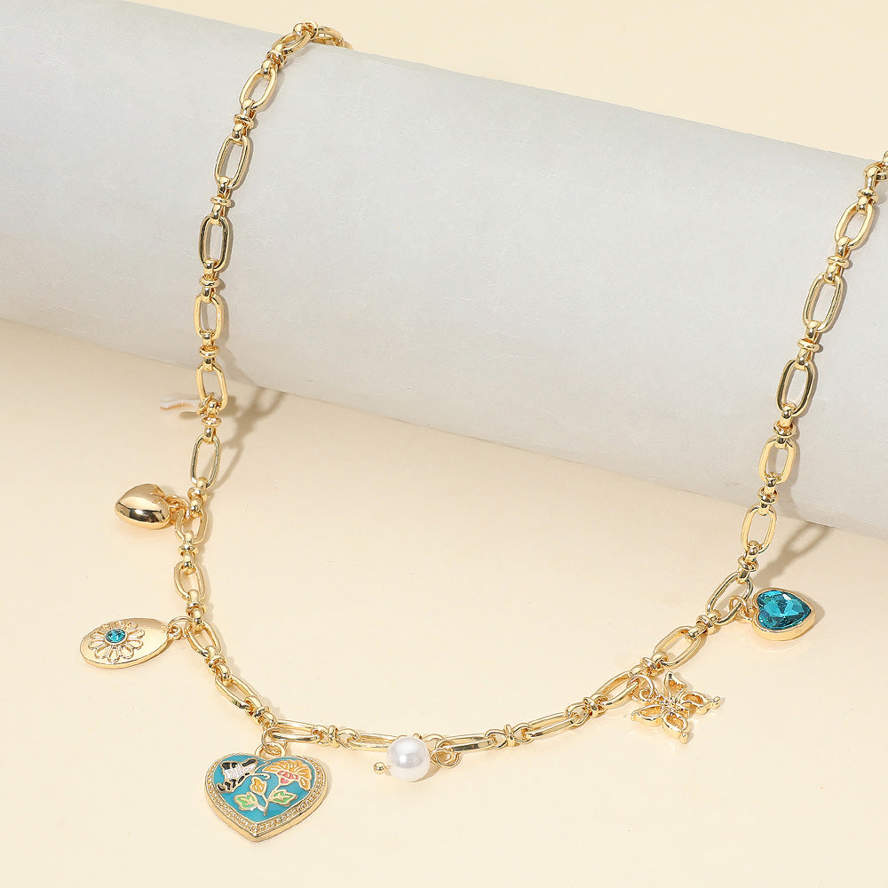 Ожерелье с подвеской в виде сердца с эмалевым узором в виде бабочки и цветка Fashnzfab, золотой/бирюза
Ожерелье с подвеской в виде сердца с эмалевым узором в виде бабочки и цветка Fashnzfab, золотой/бирюза