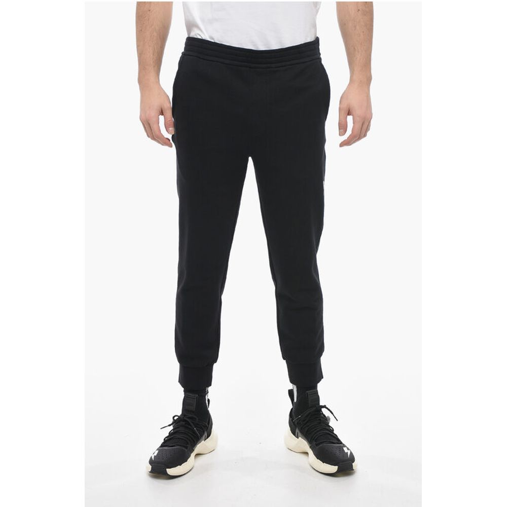 Узкие спортивные брюки из хлопка с манжетами Neil Barrett, Black
Узкие спортивные брюки из хлопка с манжетами Neil Barrett, Black