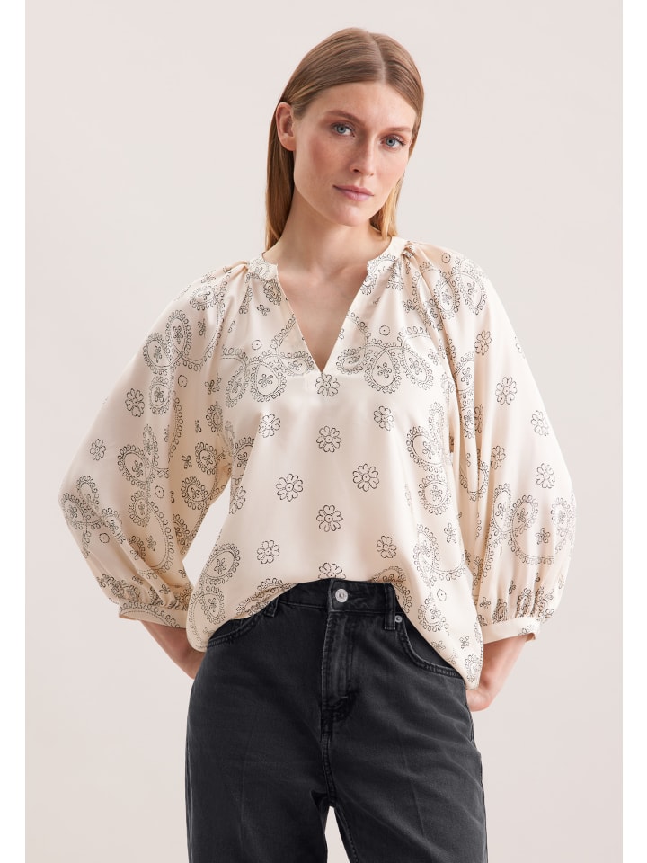 Свободная блузка без застежки цвета экрю Seidensticker
Свободная блузка без застежки цвета экрю Seidensticker