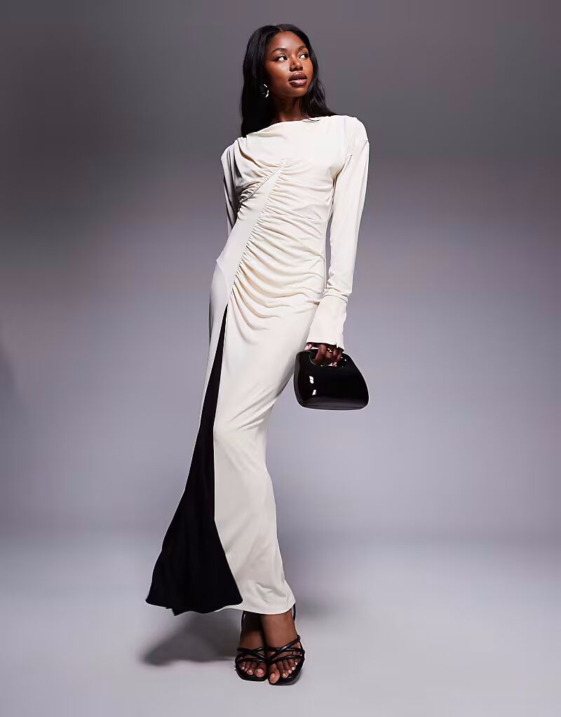 Эксклюзивное платье макси с высоким воротом от Daska в черном и белом цвете
Эксклюзивное платье макси с высоким воротом от Daska в черном и белом цвете