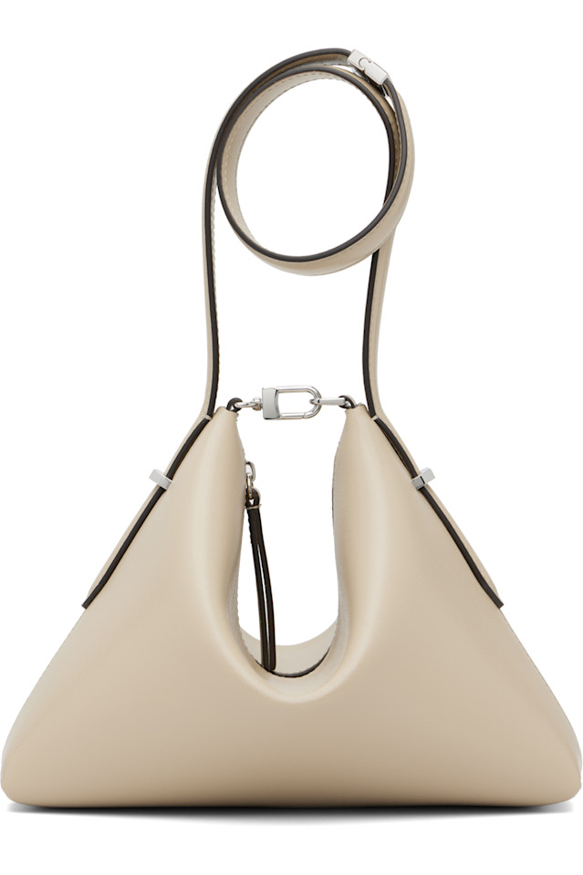 Кожаный клатч-браслет со скошенным краем Toteme, цвет fawn
Кожаный клатч-браслет со скошенным краем Toteme, цвет fawn