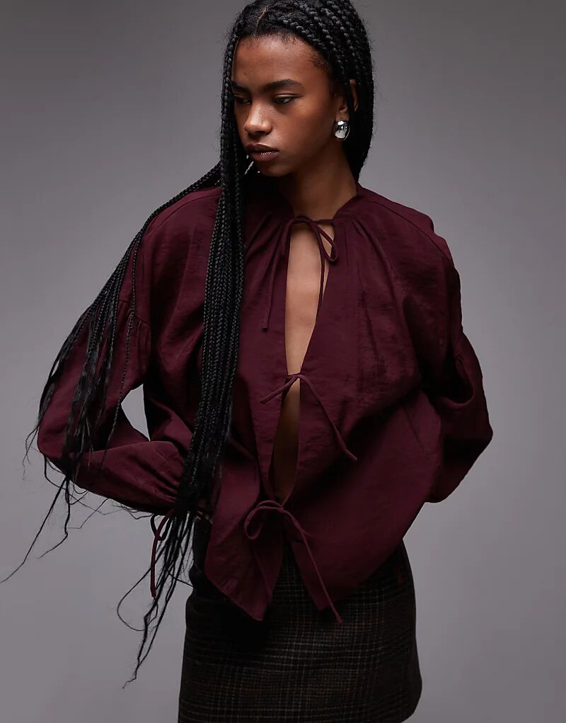 Мягкий на ощупь топ с завязками спереди в бордовом цвете Topshop
Мягкий на ощупь топ с завязками спереди в бордовом цвете Topshop